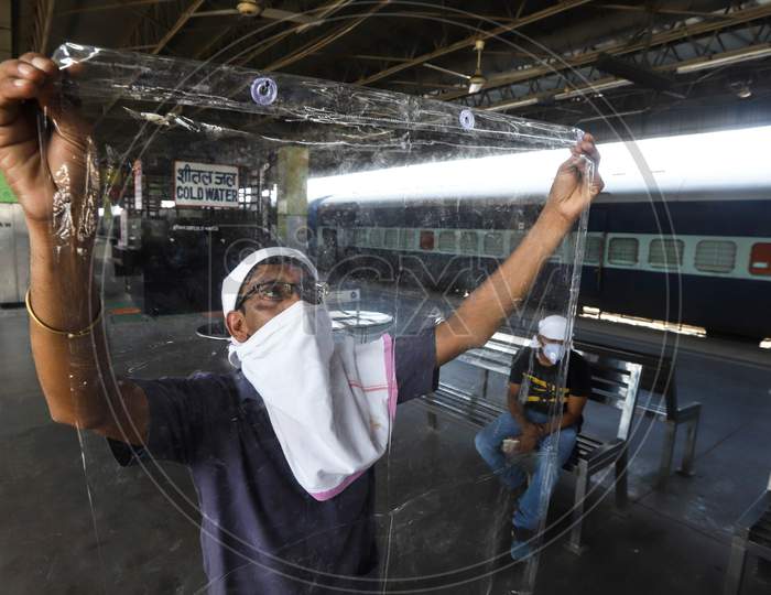 A Worker Carries Insulation Sheets For Use In Train Coaches That Have Been Turned Into Covid-19 Isolation Wards At Anand Vihar Railway Station, On June 17, 2020 In New Delhi, India.