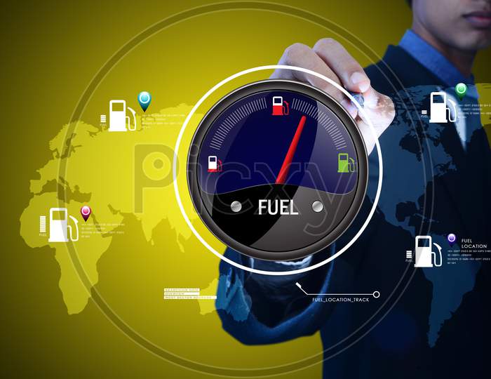 A Young Person pointing towards a Fuel Indicator