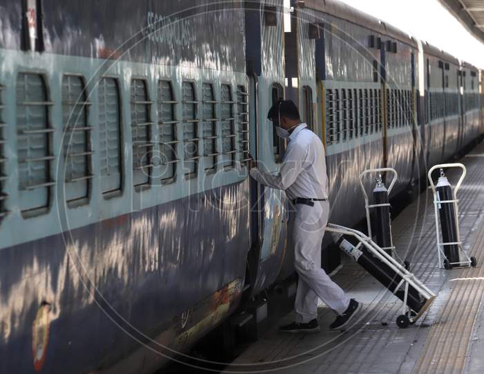Worker Carry Oxygen Cylinders Inside Anand Vihar Railway Station, Where Train Coaches Being Temporarily Converted Into Covid-19 Isolation Facilities, In New Delhi, India On June 17, 2020.