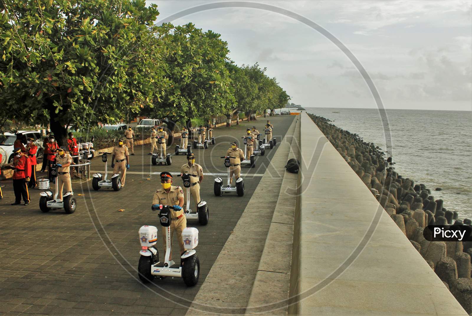 Mumbai Police officials ride Segways at the launch of ‘FREEGO self balancing scooter/Segway electric scooter’ for police patrolling on sea facing promenades in Mumbai, India on June 11, 2020.