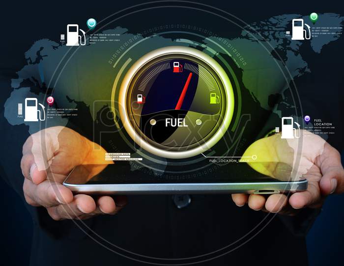Close up shot of A Person's Hand Holding a Tablet or iPad with Fuel Indicator