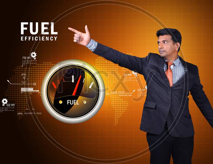 Young Indian Man pointing finger towards Fuel Efficiency