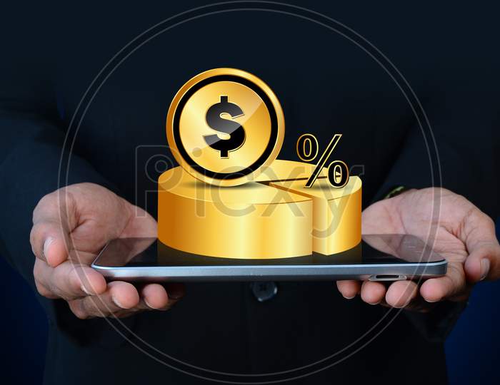 Close up shot of A person's Hand holding a Tablet with a Pie Chart and Dollar Currency Coin