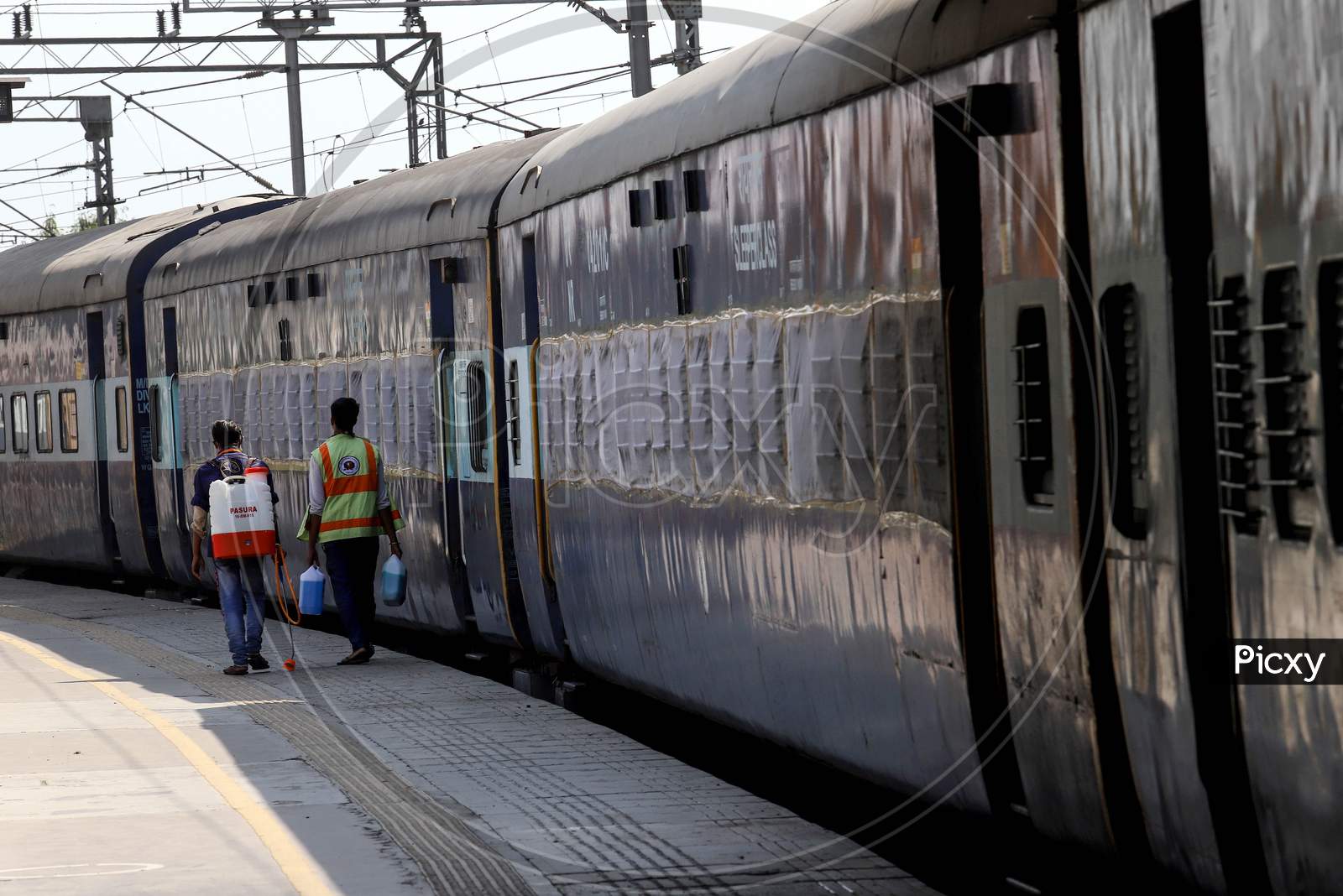 Workers Disinfect A Train Coach Which was Temporarily Converted into An Isolation Ward For Coronavirus Patients, At Anand Vihar Railway Station, On June 17, 2020 In New Delhi, India.