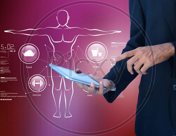 Close up shot of Person using Tablet or Smartphone with Fitness Plan in the background concept
