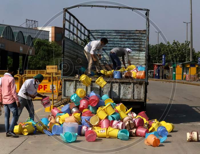 Workers Unload Dustbins For Usage In Train Coaches That Have Been Turned Into Covid-19 Isolation Wards At Anand Vihar Railway Station, On June 17, 2020 In New Delhi, India.