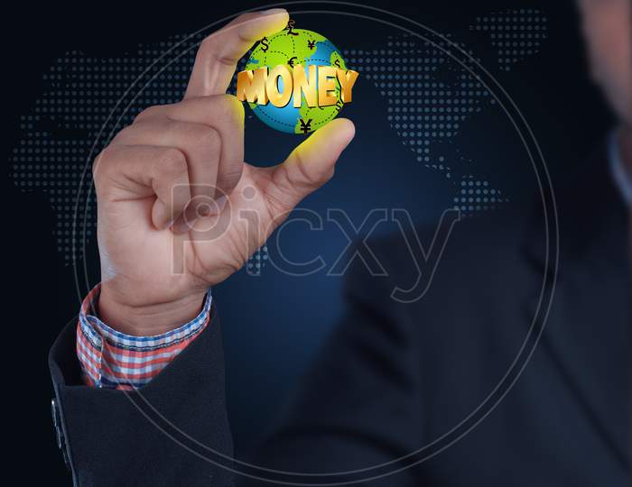 Close up shot of Person's hand holding a Money Texted Globe