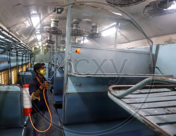 A Worker Disinfects A Train Coach Which was Temporarily Converted into An Isolation Ward For Coronavirus Patients, At Anand Vihar Railway Station, On June 17, 2020 In New Delhi, India.