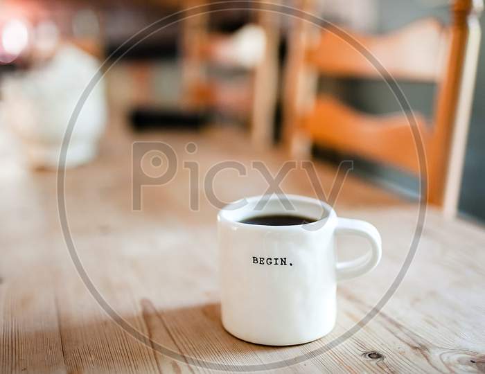 Begin word on coffee cup