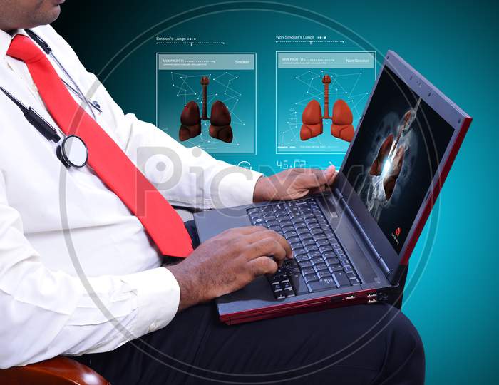 Doctor Working On Laptop