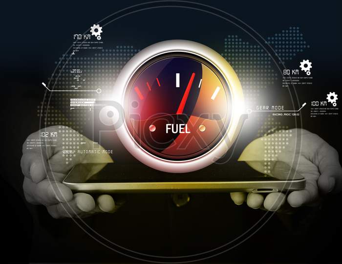 Close up of a Person's Hand holding a Tablet or iPad with Fuel Indicator