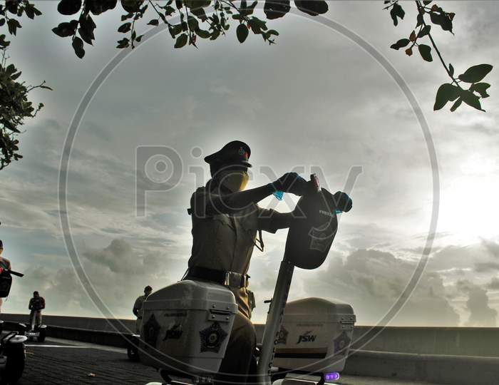 A Mumbai Police official rides a segway at the launch of ‘FREEGO self balancing scooter/Segway electric scooter’ for police patrolling on sea facing promenades in Mumbai, India on June 11, 2020.