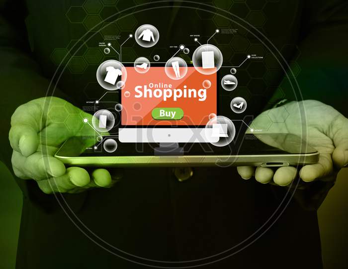 Business Man Showing Online Shopping Concept In Color Background