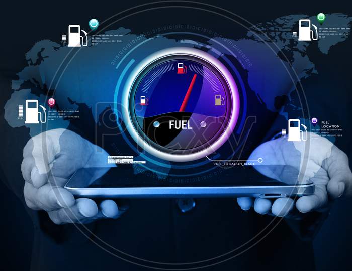 Close up shot of a Person's Hands holding Tablet or iPad with Fuel Indicator
