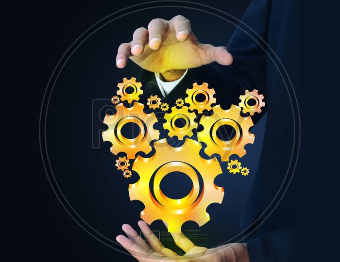 Businessman Showing Gears Cogs To Success Concept