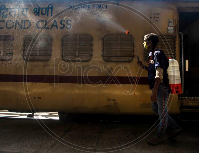 A Worker Disinfects A Train Coach Which was Temporarily Converted into An Isolation Ward For Coronavirus Patients, At Anand Vihar Railway Station, On June 17, 2020 In New Delhi, India.