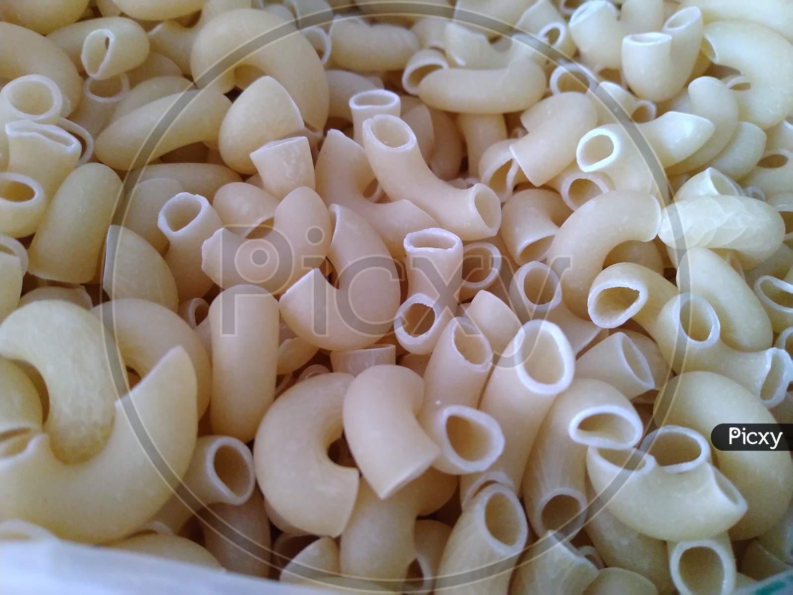raw pasta displayed for sale at a kirana store