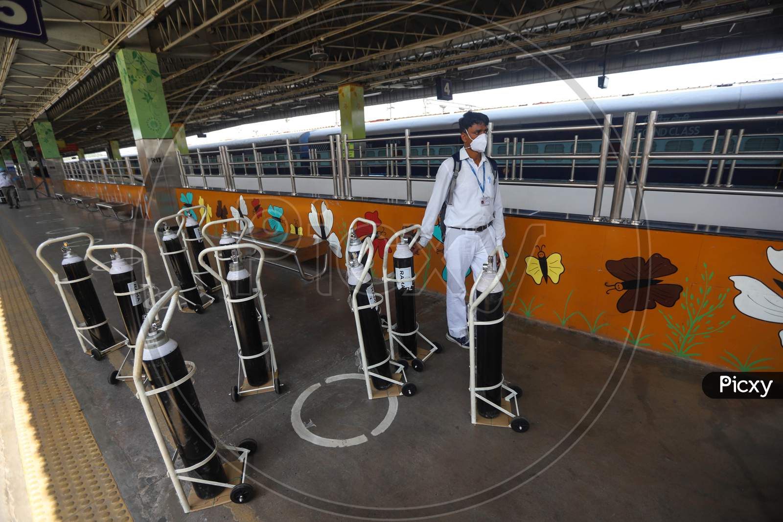 Workers Carry Oxygen Cylinders Inside Anand Vihar Railway Station, Where Train Coaches Are Being Temporarily Converted Into Covid-19 Isolation Facilities, In New Delhi, India On June 17, 2020.