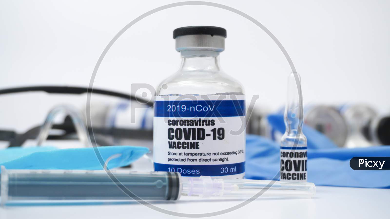 Covid-19 Corona Virus 2019-Ncov Vaccine Vials Medicine Drug Ampoule Bottle Syringe Injection Medical Nitrile Gloves Mask Glasses. Vaccination, Treatment To Cure Covid 19 Corona Virus Infection.