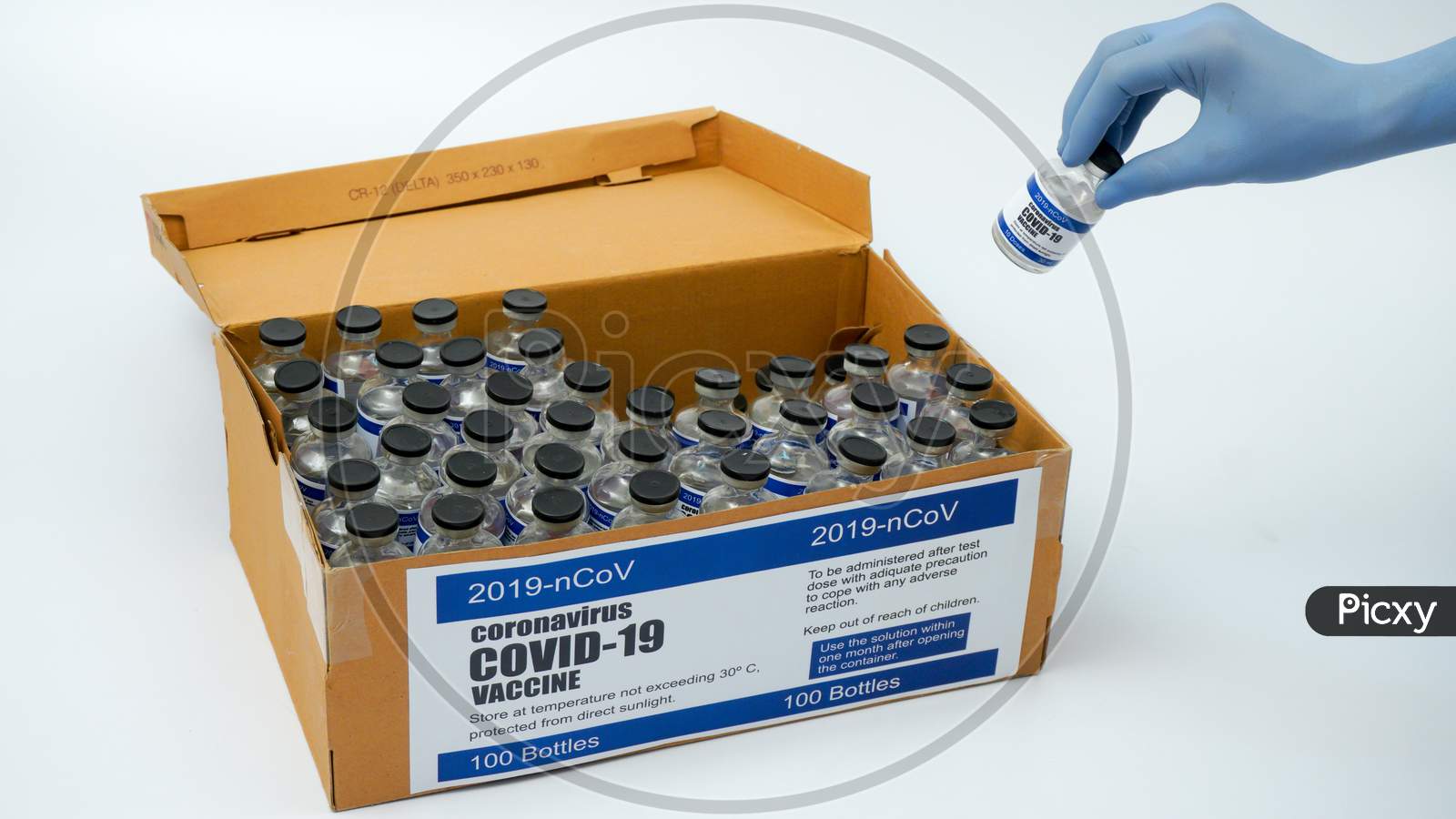 Covid-19 Corona Virus 2019-Ncov Vaccine Vials Medicine Drug Bottles Injection Blue Nitrile Surgical Gloves Box. Vaccination, Immunization, Treatment To Cure Covid 19 Corona Virus Infection Concept.