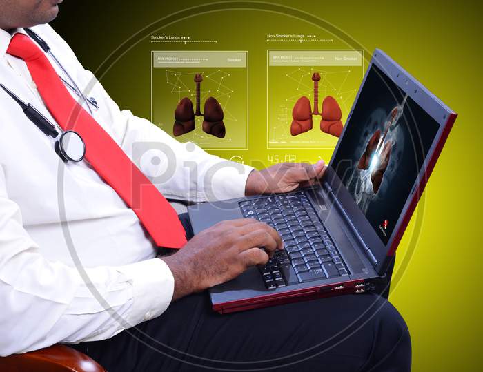 Doctor Working On Laptop