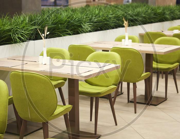 White table and green chairs