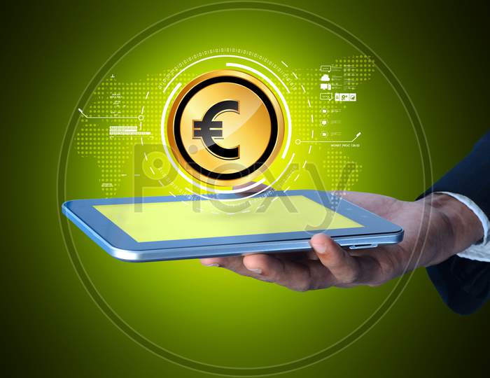 Close up of a Person's Hand holding a Tablet or iPad with Euro Currency Coin