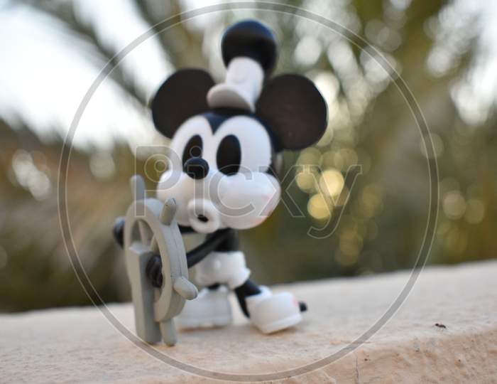 Steamboat Willie Mickey Mouse On Bokeh Background.