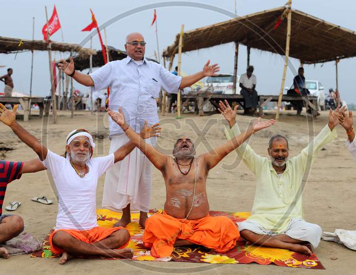People Perform Yoga On The Occasion Of International Yoga Day On The Banks Of River Ganga In Prayagraj, June 21, 2020.