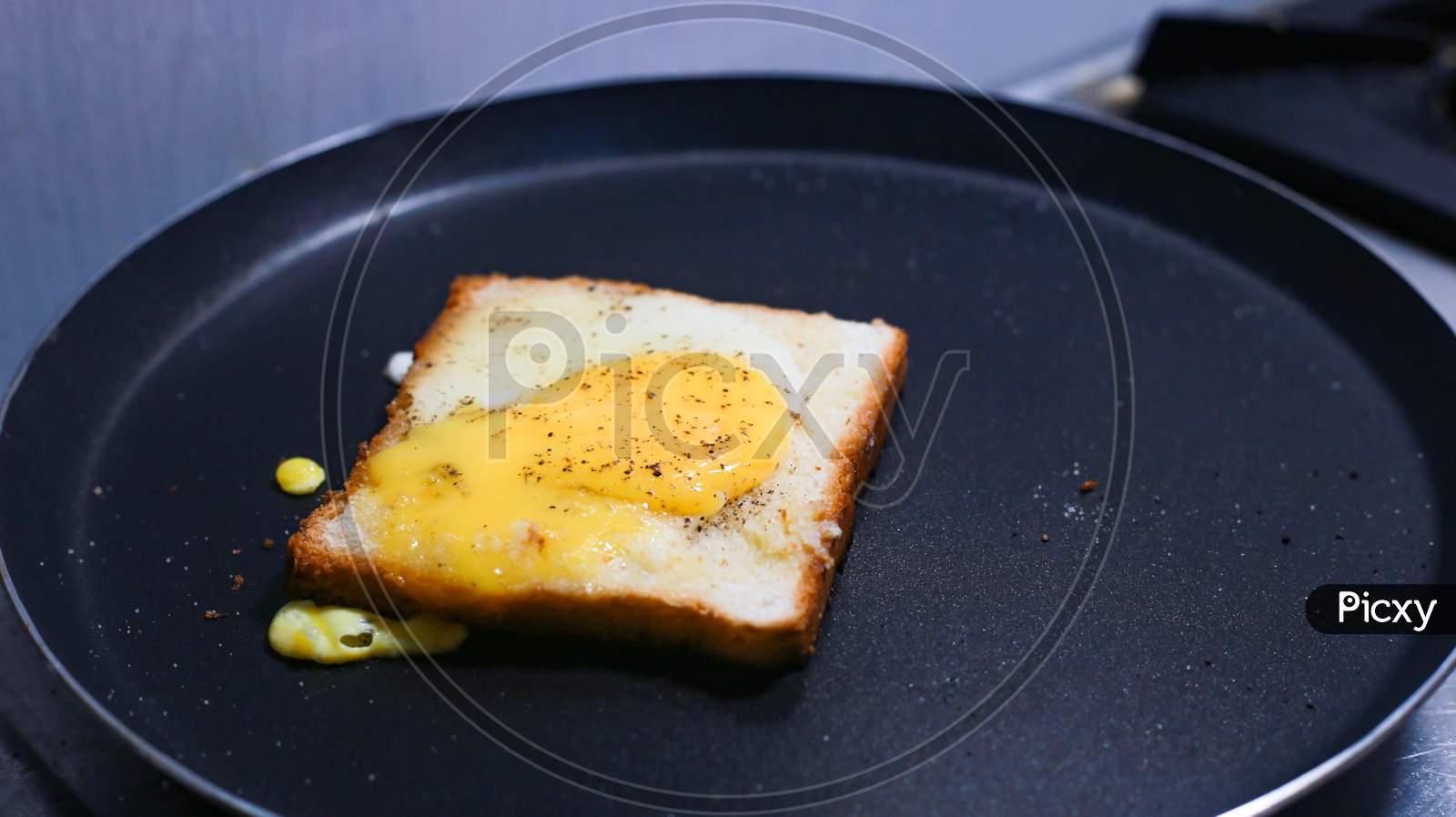 Bread Bulls Eye With Bread Toast On The Cooking Pan