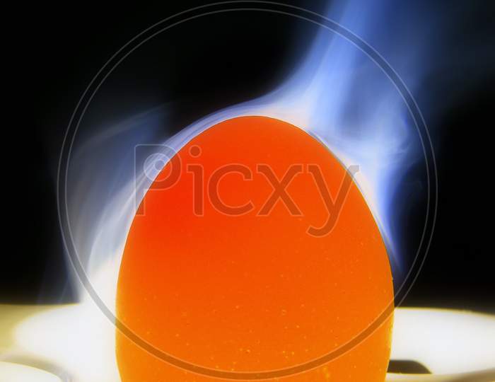 Egg with smoke with black background