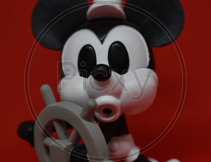 Steamboat Willie Mickey Mouse On Red Background.