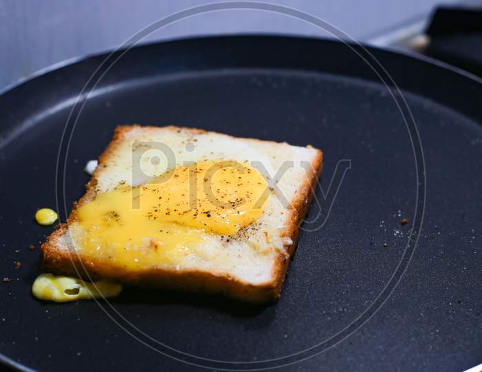 Bread Bulls Eye With Bread Toast On The Cooking Pan