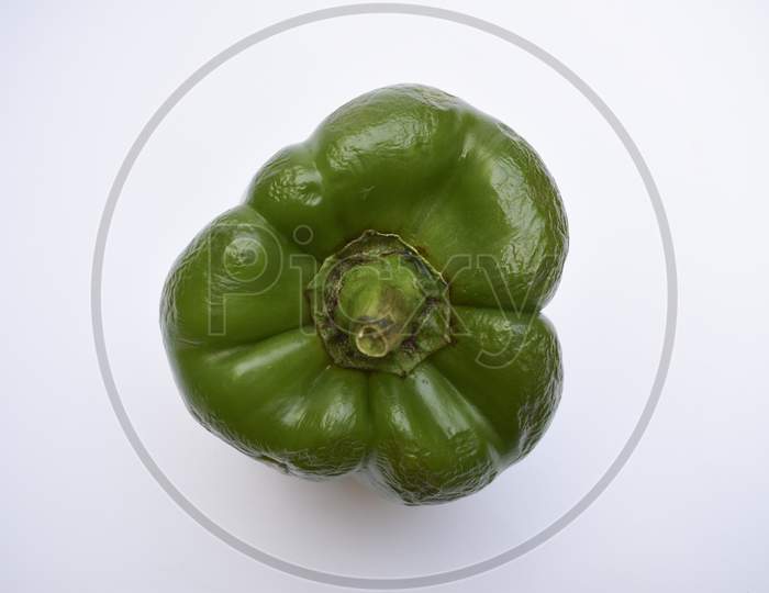 Top View Of Green Capsicum Or Green Bellpepper On White Background