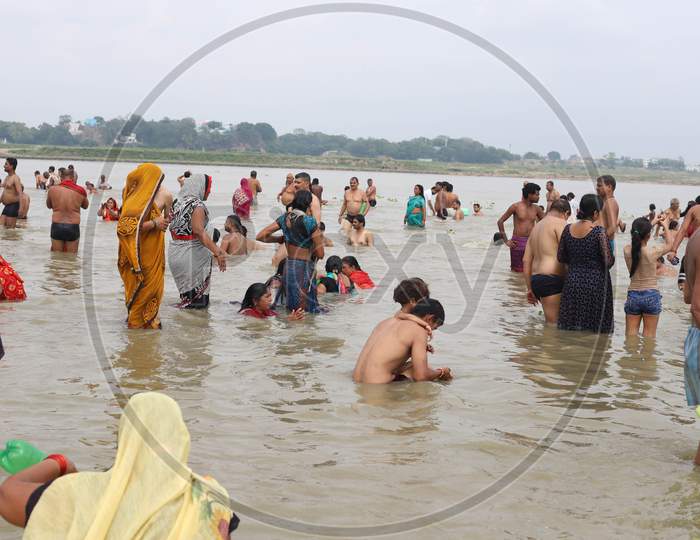 Hindu Devotees Take Holy Dip In The Sangam, Confluence Of Three Rivers The Ganga, Yamuna And Saraswati During Solar Eclipse In Prayagraj, June 21, 2020.
