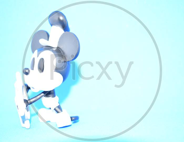 Steamboat Willie Mickey Mouse On Blue Background.