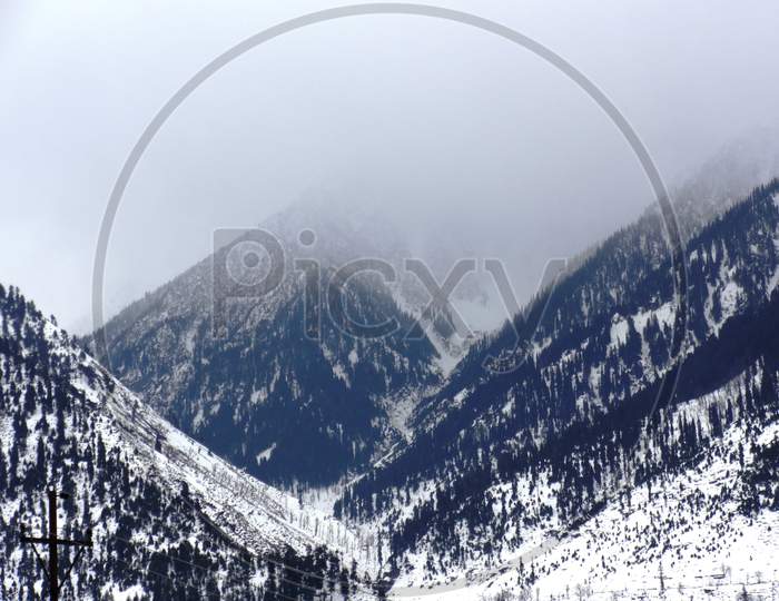 view of snow capped hills in the valley of Srinagar, Kashmir, India