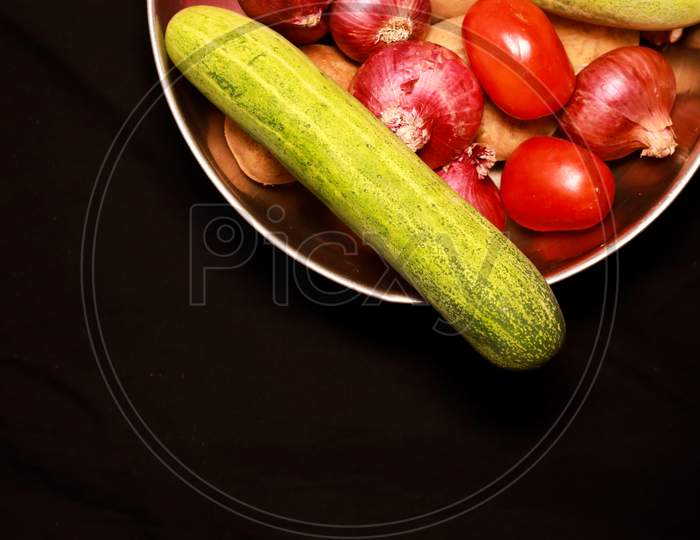 Vegetables In A Steel Bowl With Black Background