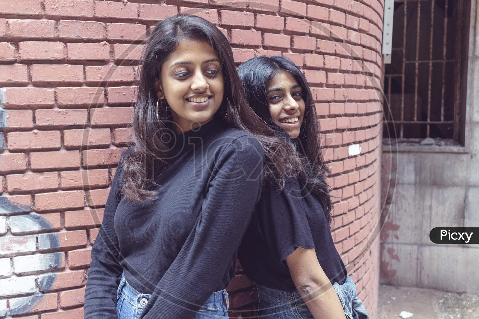 Friends Forever. Two Cute Lovely Girl Friends Posing With Smile