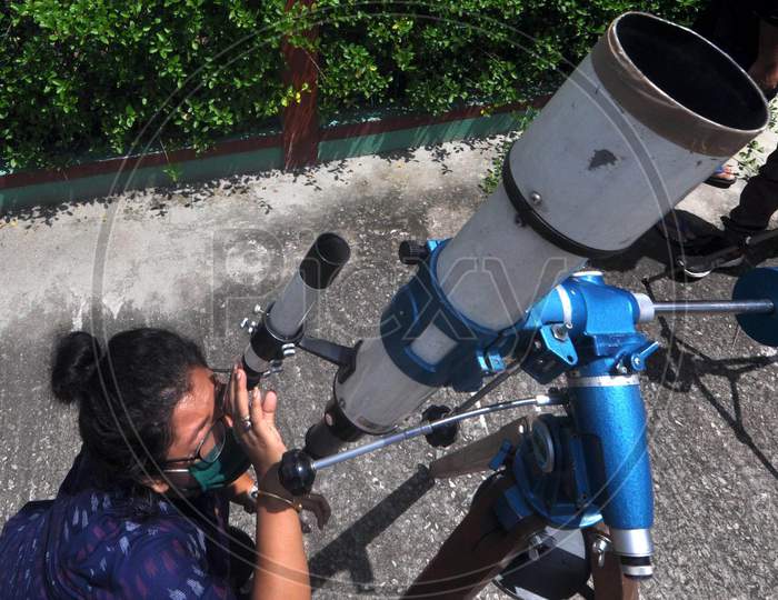 People Looks Through A Telescope To Get A Glimpse Of Solar Eclipse, At Guwahati Planetarium In Guwahati, Sunday, June 21, 2020.