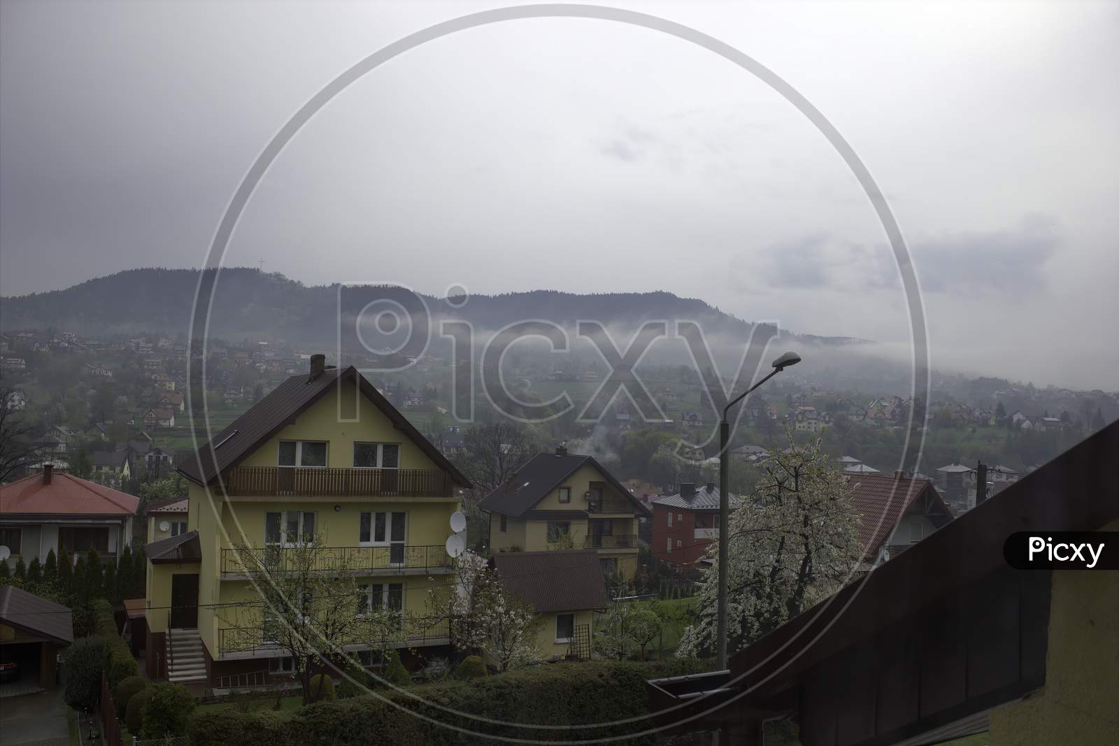 Residential Area On A Foggy Day In Small Country Side Town Named Limanowa Located In Poland, Europe