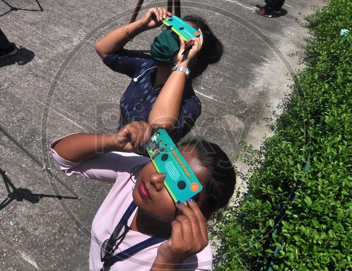 Girls View Solar Eclipse Using A Filter, In Guwahati, Sunday, June 21, 2020.