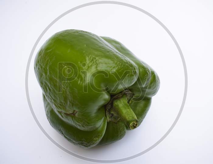 Side View Of Green Capsicum Or Green Bellpepper On White Background