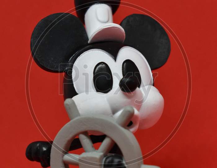 Steamboat Willie Mickey Mouse On Red Background.