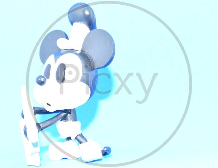 Steamboat Willie Mickey Mouse On Blue Background.