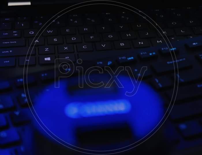 close up of a keyboard in blue low light