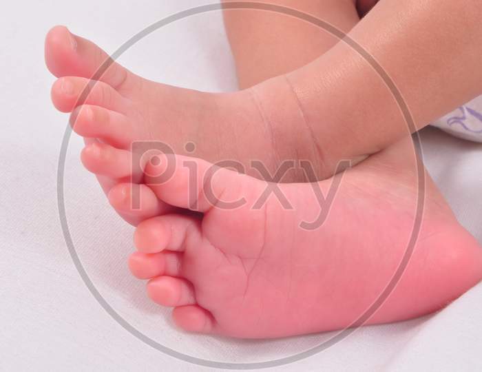 Baby Feet Crossed While Sleeping.