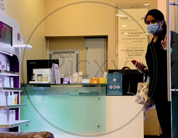 a young girl in a medical mask and hand gloves - coronavirus outbreak