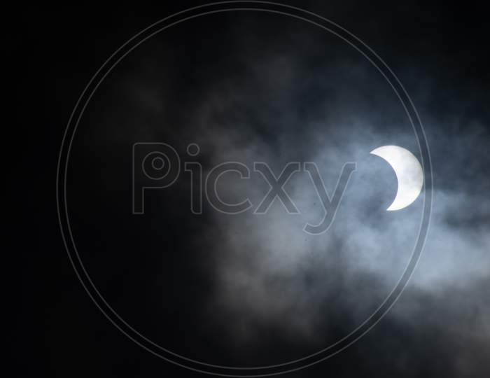 Partial Annular Solar Eclipse amid dark clouds seen in Hyderabad on June 21,2020.