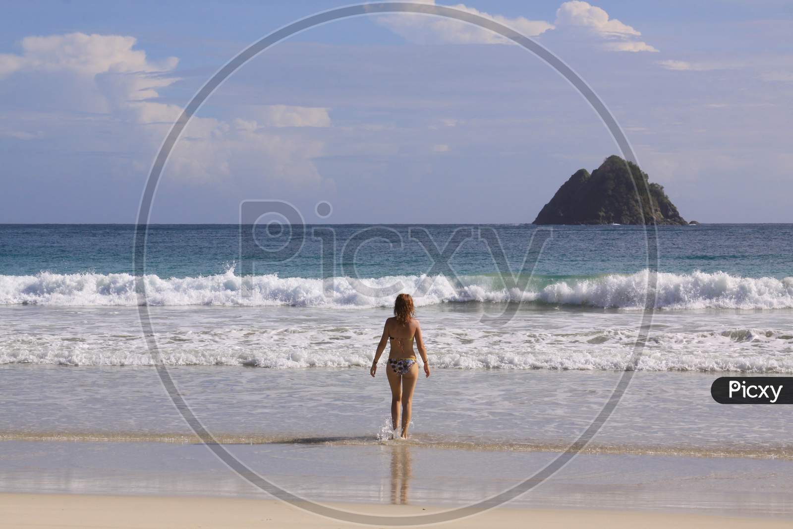 Woman Tourist In Water At Mawun Beach Lombok